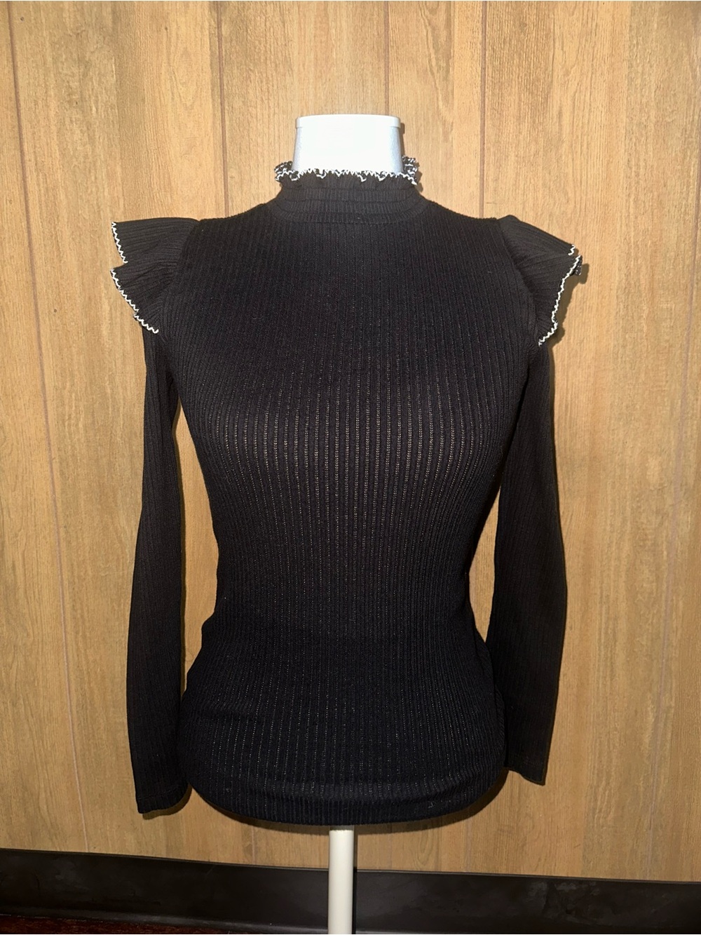Black Ribbed Mock-Neck Sweater with Ruffle Trim